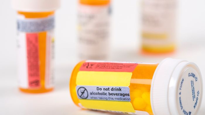 pill bottles with body and top labels